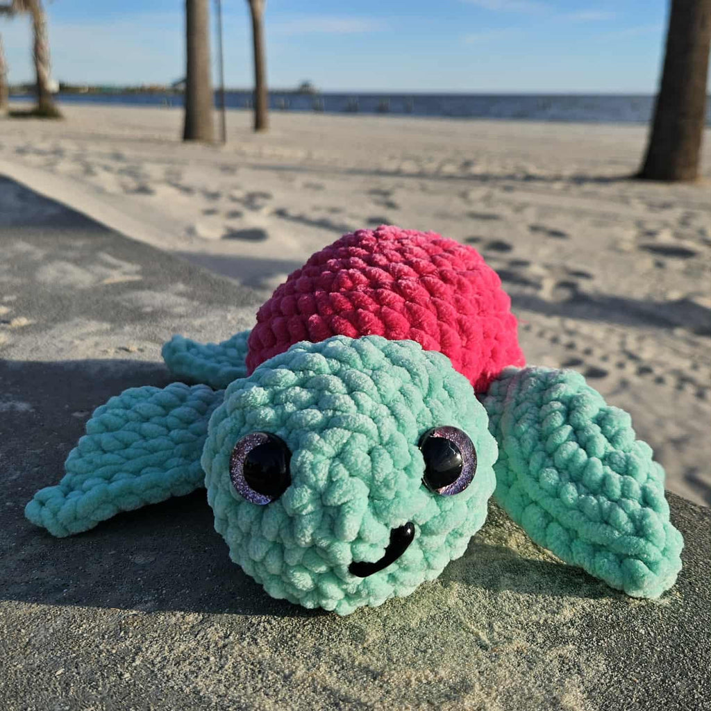 baby sea turtle stuffed animal at the beach