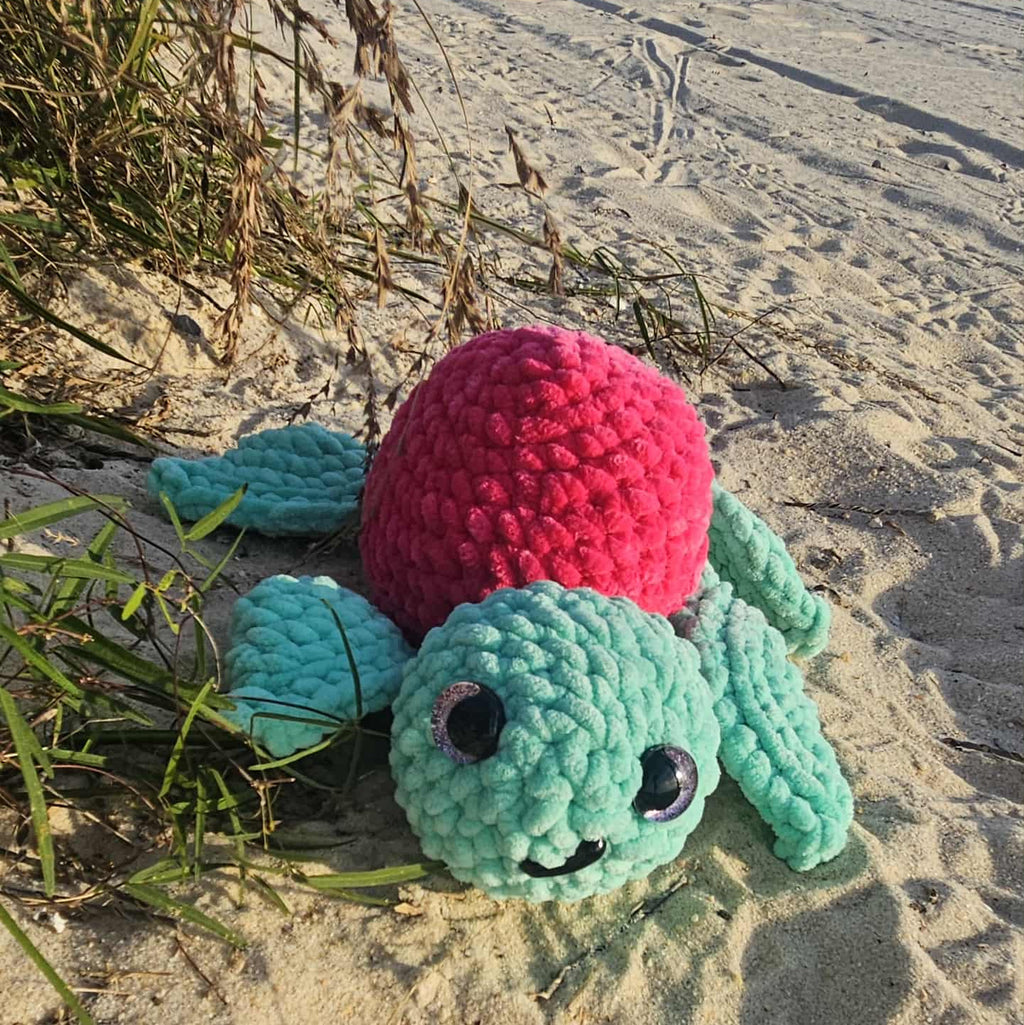 baby sea turtle stuffed animal at the beach