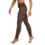 Left side view of black and gold sea slug leggings feature a continuous pattern from top to bottom of leggings.
