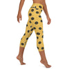 Right side view of model in comfy Blue-Ringed Octopus capri yoga leggings.