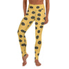 A person wearing Blue-Ringed Octopus yoga leggings with a yellow background and brown spots outlined in dark blue.