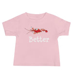 Baby T-Shirt in color pink with a candy stripe pistol shrimp and the word better under the shrimp.