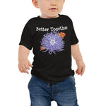 Baby wearing a Clownfish & Anemone Friendship Baby T-Shirt in color black in size 6-12m.