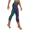 Right side view of capri leggings with crocea clam pattern featured on right leg.