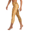 Left side view of person in the Flamingo Tongue Snail capri leggings with left side leg detail.