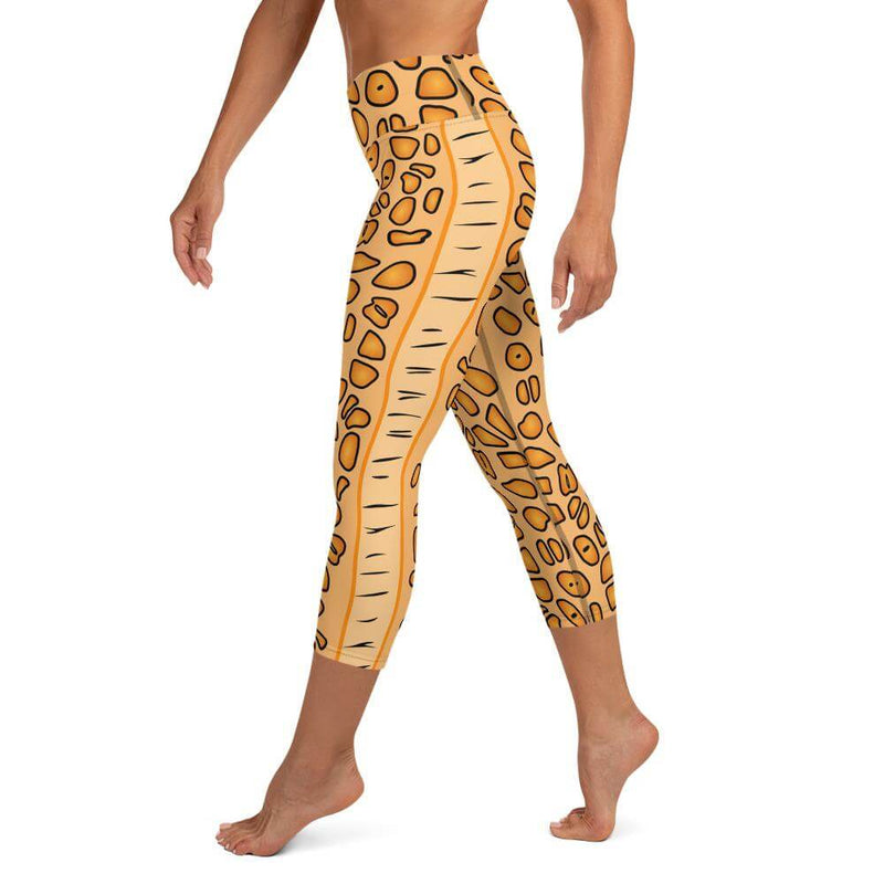 Left side view of person in the Flamingo Tongue Snail capri leggings with left side leg detail.