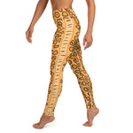 Left side view of person in the Flamingo Tongue Snail leggings with left side leg detail.