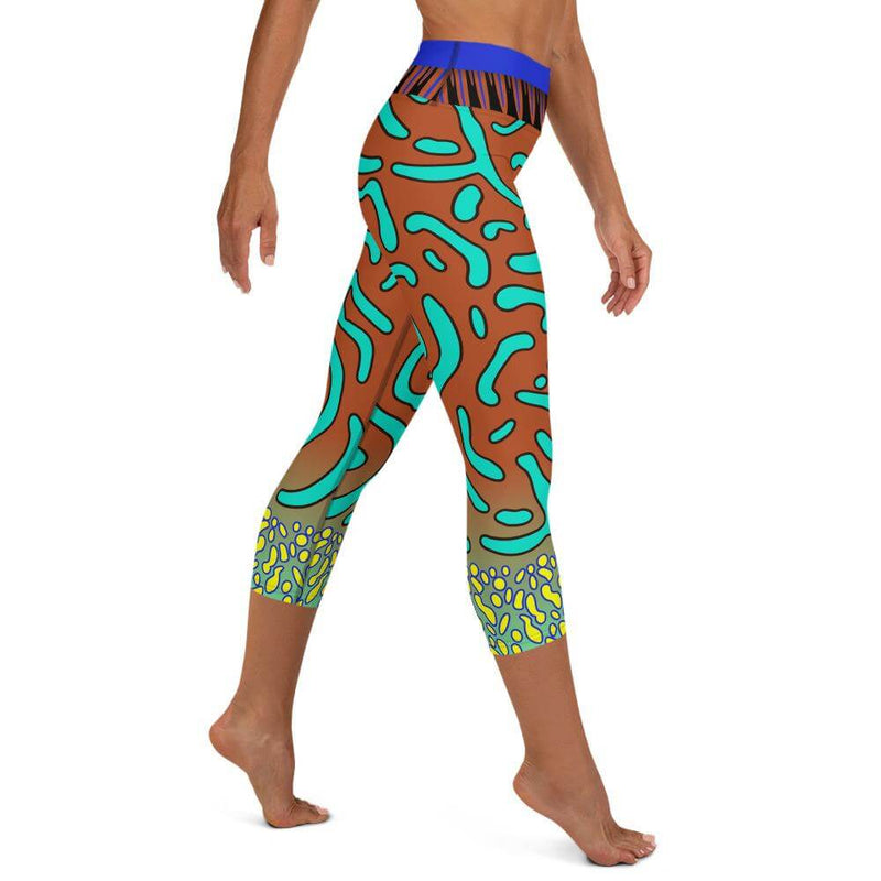 Right view of a person  in colorful patterned green mandarin fish every-day capri leggings.