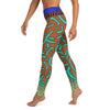 Left view of a person in organic inspired green mandarin fish patterned leggings.