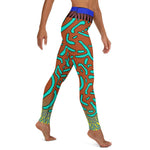 Right view of a person in colorful patterned green mandarin fish every-day leggings.