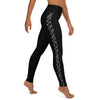 Right side view of a person in black athleisure hammerhead shark leggings.