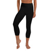 Front view of a woman in black hammerhead shark workout capri leggings. 