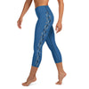 A person in blue capri length leggings with a contrasting hammerhead shark pattern running down the outside of each leg.
