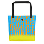 Bright and colorful tote bag with Harlequin FIlefish pattern in turquoise blue, orange and yellow, Thalassas logo at top of bag.