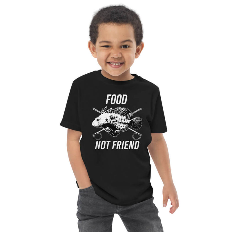 Kid wearing black t-shirt with short sleeves and food not friend design, kids size 2.