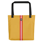 Yellow tote bag with red and white stripe down the middle and Thalassas logo at top, pattern inspired by Skunk Cleaner Shrimp.