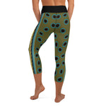 Back view of person in Spotted Mandarin Fish capri yoga leggings with spotted mandarin fish pattern.