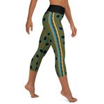 Right side view of model in Spotted Mandarin Fish of capri leggings.