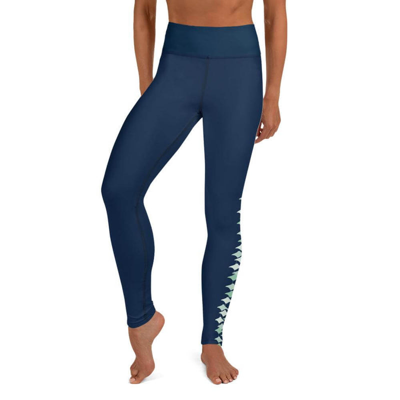 Front view of a person wearing classic navy blue leggings with stingray pattern.