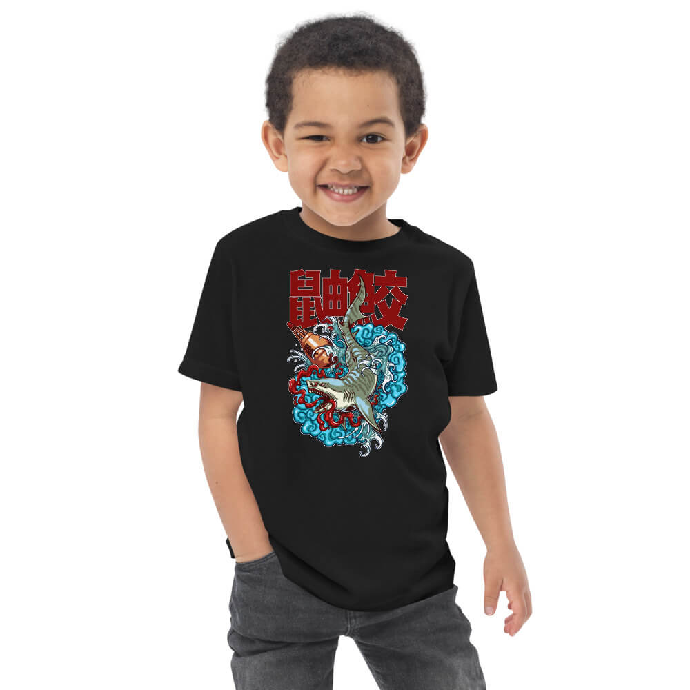 Kid wearing a black short sleeve t-shirt, with tiger shark design in kids size 2.