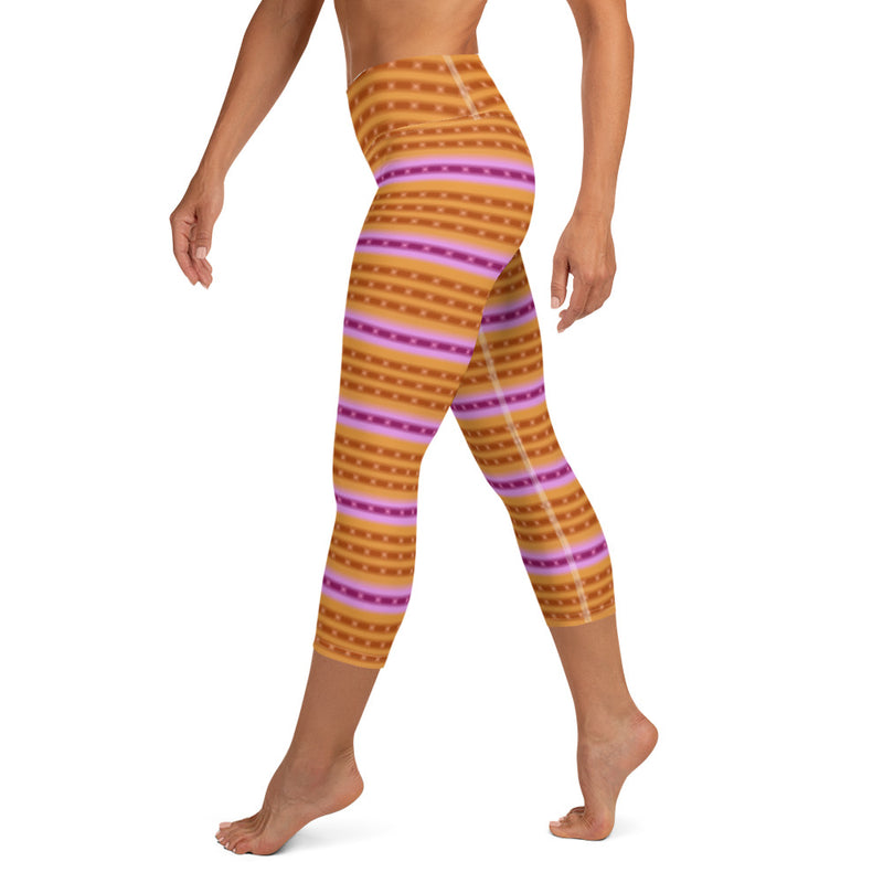 Left side view of bright patterned purple-ringed top snail capri leggings.