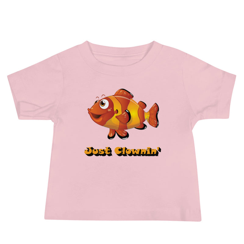 Pink baby jersey tee with short sleeves and just clownin design with clownfish in center and words just clowning under the fish.