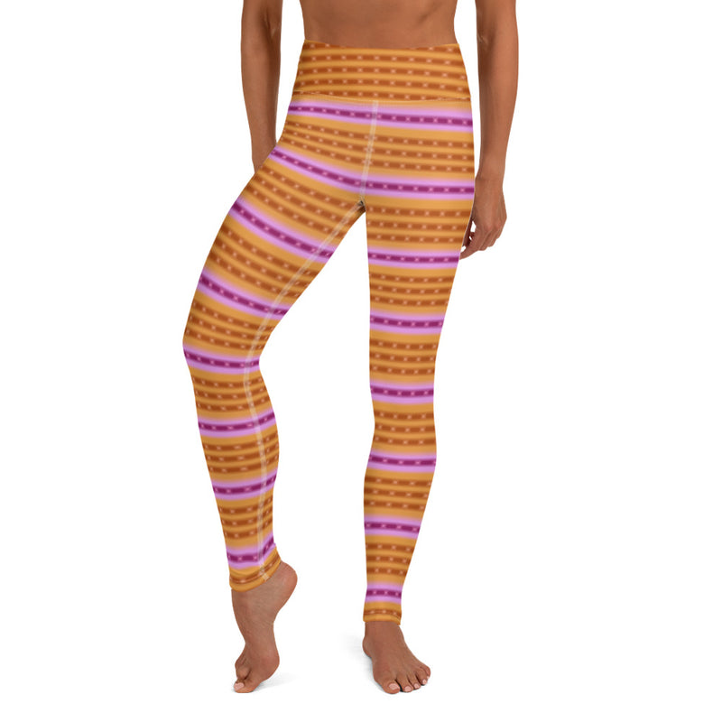 A person wearing orange yoga leggings, purple, pink, dark orange ringed design inspired by the Purple-Ringed Top snail. 