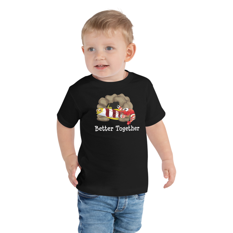 Toddler wearing a black short sleeve t-shirt with Red-banded goby and candy stripe pistol shrimp friendship design, size 2T. 