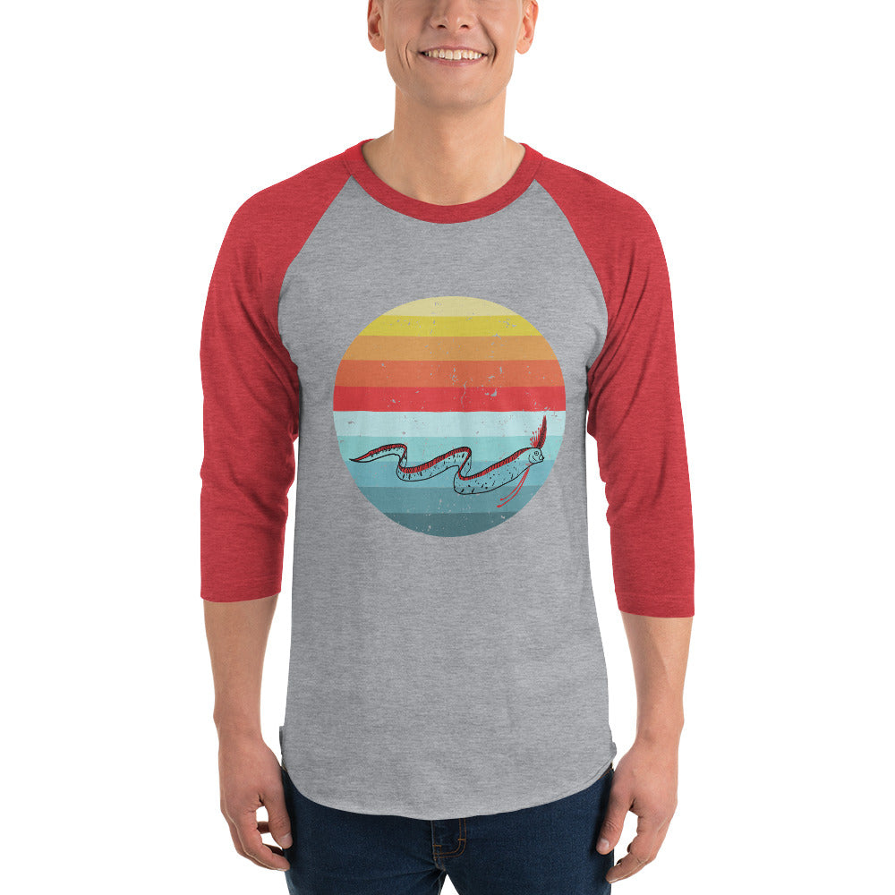 Person wearing ¾ sleeve raglan shirt with oarfish design, red sleeves, grey body, heather grey/heather red color option.