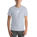 Person wearing a light blue short sleeve t-shirt with thalassas logo.